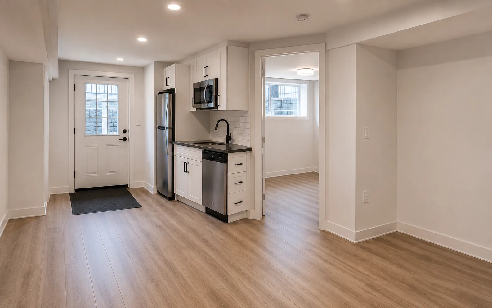 Legal basement suite layout in an Ottawa home, egress window and separate entrance